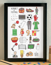 Framed poster titled 'Alphabet of Football' on a wall with a small table and pencil holder below.