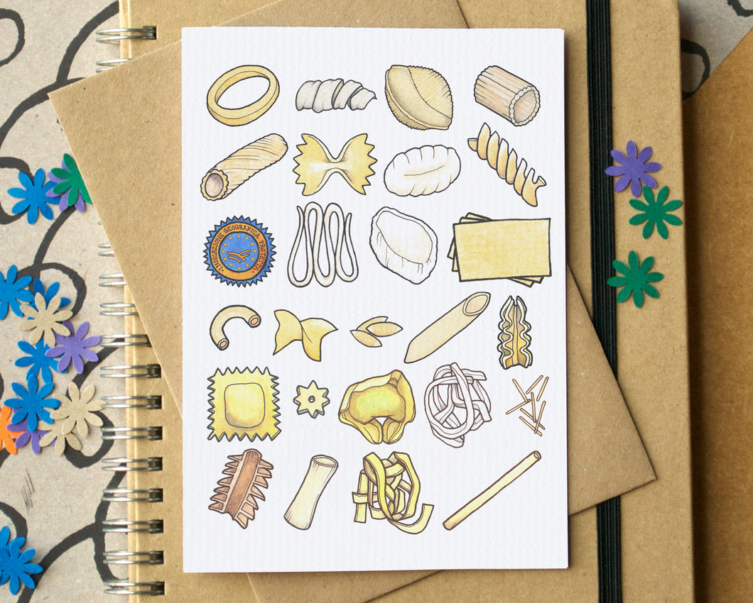 Notebook with a greetings card featuring pasta illustrations on top